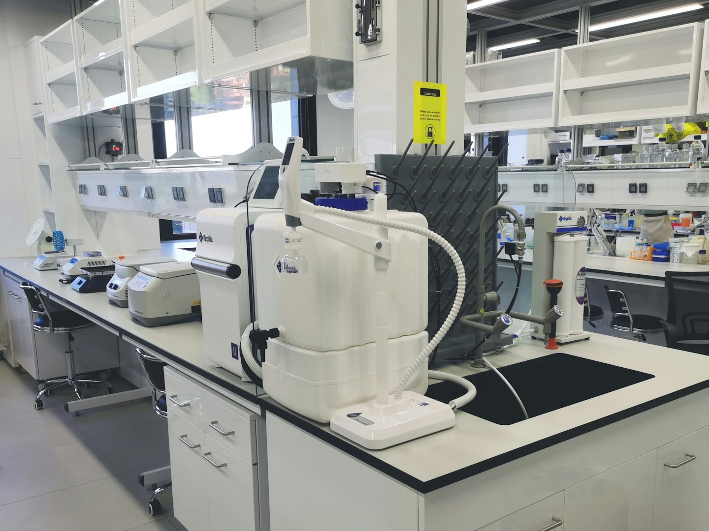 Scientific laboratory equipment on a white counter.